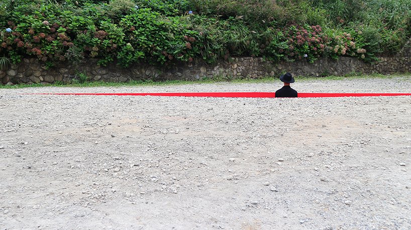 a red wound cuts the earth for hajime yoshida + yoshihiro mikamis land art in japan